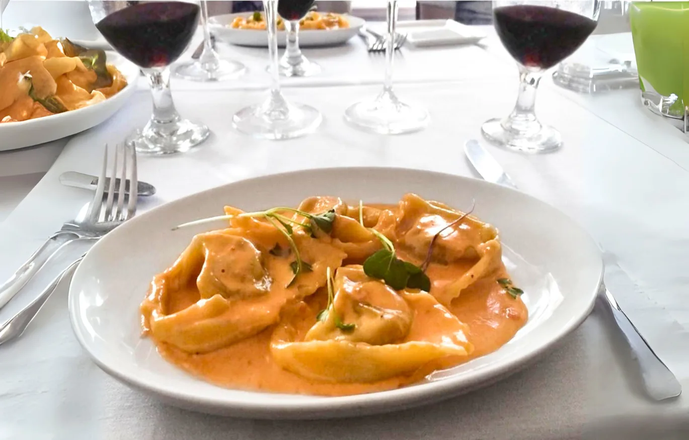 Handmade stuffed pasta in tomato cream sauce made at a cooking class